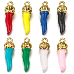 Macro shot of 8 colorful chili pepper charms with golden crowns on white background