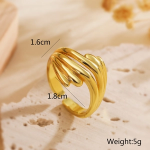 Macro shot of gold layered wavy ring showing 1.6cm width and 1.8cm adjustable diameter
