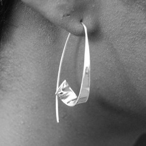 Artistic silver ribbon curved hoop earrings in geometric style for modern women