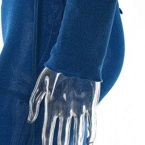 Detailed macro view of the blue elastic knit sleeve featuring a delicate lettuce edge trim