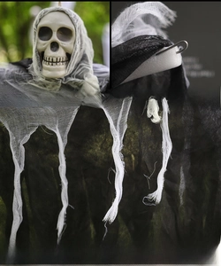 Close-up of Halloween hanging ghost showing skull head, wire hook and mesh fabric details