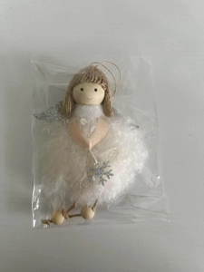 Detail of a handmade plush Christmas angel ornament with silver wings and wooden beads