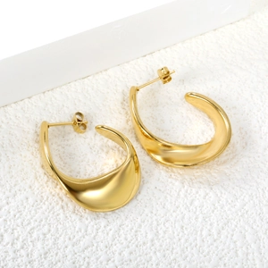 Minimalist chunky gold C-shaped hoop earrings with a high-polished metallic finish