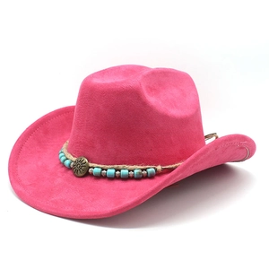 Detail of rose red suede cowboy hat with braided cord and sun-shaped metal buckle