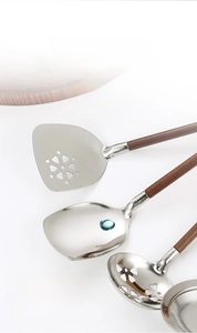 Detail of 304 stainless steel kitchen tools with walnut handles and SUS 304 engraved logo