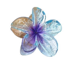 Glittery gradient plumeria flower hair claw clip in purple and orange resin finish