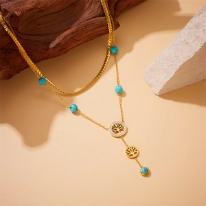 Double-layer gold plated stainless steel necklace featuring turquoise beads and tree of life charms
