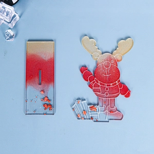 Detail of red glitter Christmas reindeer acrylic stand with a matching clear base