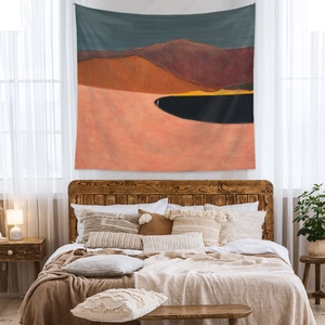 Artistic landscape tapestry featuring orange mountains and a blue lake for wall decor