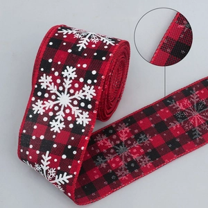 Red and black buffalo plaid Christmas ribbon with snowflake patterns and stitched edges
