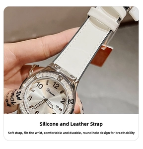 Close-up of women's quartz watch with rhinestone bezel and white silicone leather strap