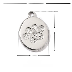 Macro detail of stainless steel paw print pendant showing 14mm height and 10mm width