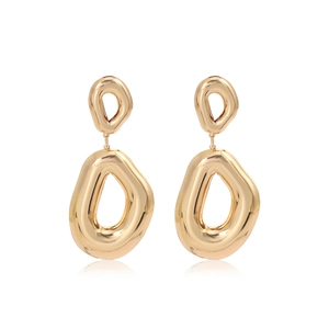 Detailed view of hollow irregular oval drop earrings with polished gold finish