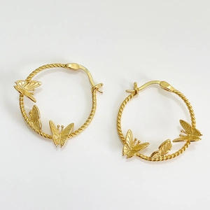 925 silver gold-plated hoop earrings with irregular butterfly relief on white background
