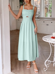 Mint green pleated midi dress with spaghetti straps and front cutout detail