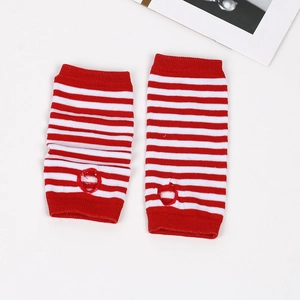 Close-up of red and white striped knit arm sleeves with thumb hole detail