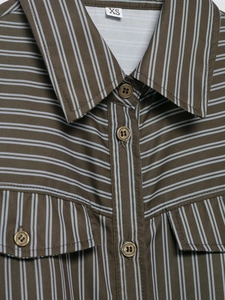 Detail of blue striped poplin shirt neckline with brown base and size tag XS