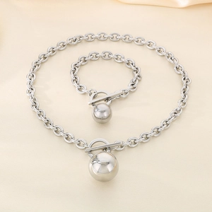 Detail of silver titanium steel necklace and bracelet set with ball pendants and OT clasps