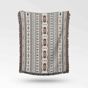 Detailed view of Southwestern style woven blanket featuring geometric patterns and fringe