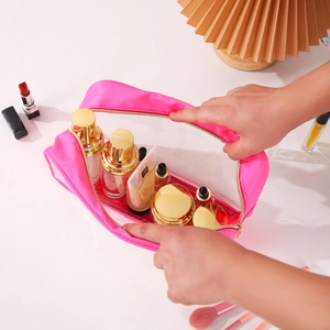Pink waterproof travel toiletry bag with transparent window and zipper closure