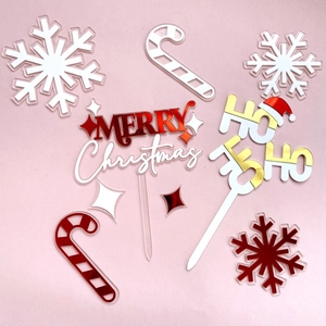 Acrylic Christmas cake topper set featuring snowflakes candy canes and Merry Christmas signs.