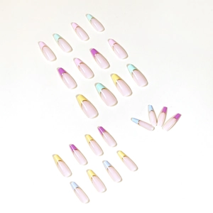 Rainbow French tip press-on nails in long coffin shape with gold borders and pastel tones