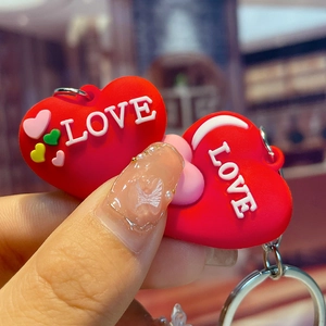 Modern red heart PVC keychain with 3D LOVE text and colorful patterns on a metal ring