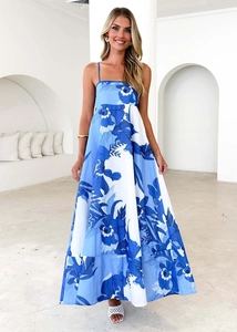 Detailed view of the blue floral print fabric and thin straps on a summer midi dress