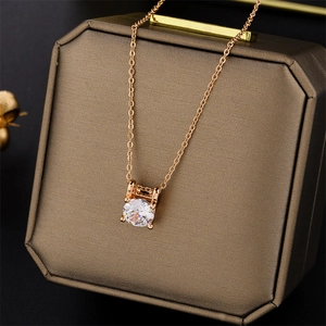Rose gold necklace with a single round zircon solitaire pendant on a jewelry gift box