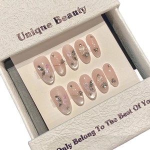 Pink cat eye handmade press-on nails with 3D butterfly, pearls and rhinestones