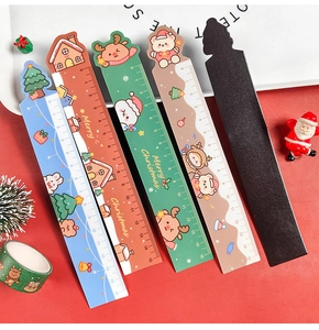 Close-up of 15cm magnetic Christmas rulers featuring Santa, reindeer and snowman designs