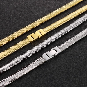 8mm gold and silver snake chain necklaces with fold-over clasps on black background