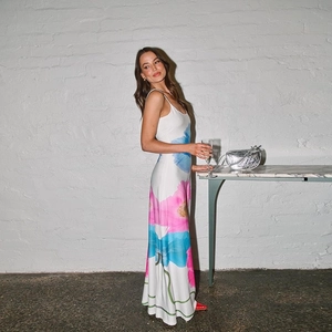 Detail of floral backless maxi dress in satin fabric with pink and blue flower print