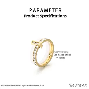 Detail view of 8mm wide gold stainless steel and white ceramic ring with zircon stones