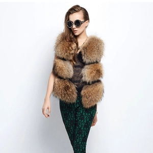 Chic multi-layered raccoon fur vest in tan brown with a fluffy sleeveless silhouette