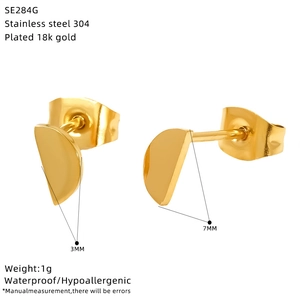 Macro detail of gold plated stainless steel stud earrings with size and weight info