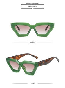 Detail view of geometric cat-eye sunglasses with green frames and tortoiseshell temples