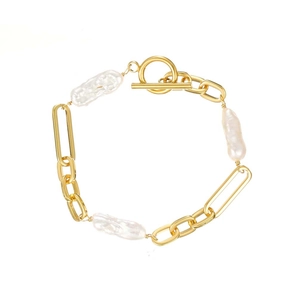 Elegant gold chain bracelet featuring three large white baroque pearls and a secure OT clasp