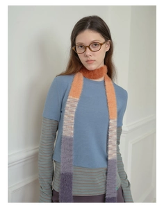 Close-up of Y2K gradient faux mink fur scarf with orange and purple color blocking texture