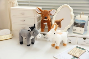Detailed view of plush animal toys featuring a gray donkey, spotted deer, and white goat
