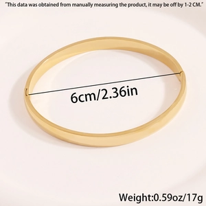 Detailed view of gold stainless steel bangle with 6cm inner diameter and 17g weight specs