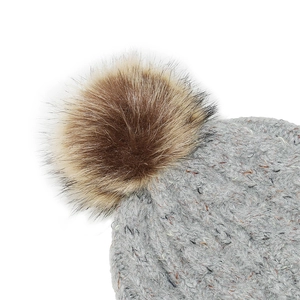 Close-up of grey knit beanie texture featuring a fluffy brown faux fur pompom on top
