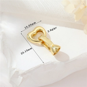 Detailed view of 14K gold plated heart clasp with precise 13.33mm by 23.13mm dimensions