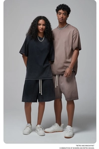 Studio shot of retro washed cotton streetwear set with oversized tee and drawstring shorts