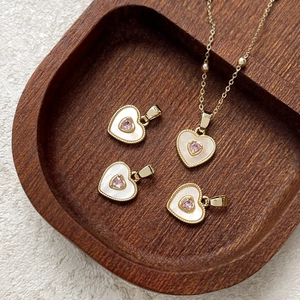 18k gold-plated heart pendant necklace with pink gem and white shell inlay detail