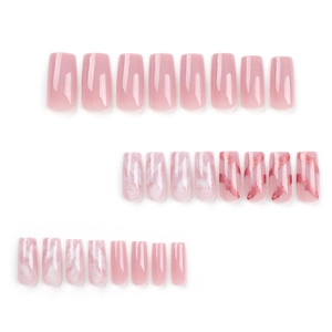 Long pink press-on nails with marble texture and rose gold foil accents on white background