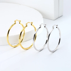 Polished S925 sterling silver hollow twisted hoop earrings in gold and silver finish
