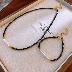 Vintage black crystal bead necklace and bracelet set with baroque pearl and gold accents