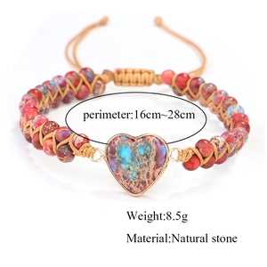Detail of handmade red imperial stone heart bracelet with woven double-layer beads