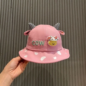 Close-up of pink cotton sun hat with cow print brim and 3D horns for toddlers
